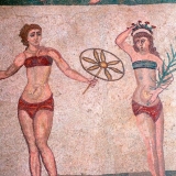 Mosaic in the Roman Villa of Casale, near Piazza Armerina, Sicily, Italy. The villa boasts the best collection of Roman mosaics in the world and is a UNESCO World Heritage Site. This example shows women exercising. Credit: Spectrum Colour Library / HIP / TopFoto